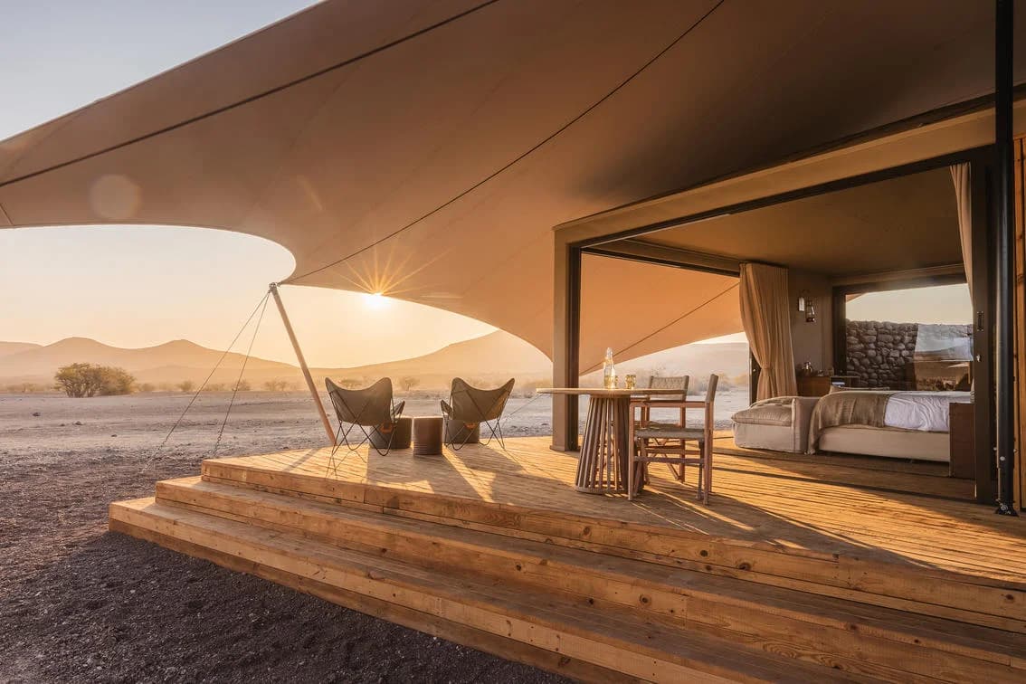 Desert Rhino Camp – bed and deck in the morning