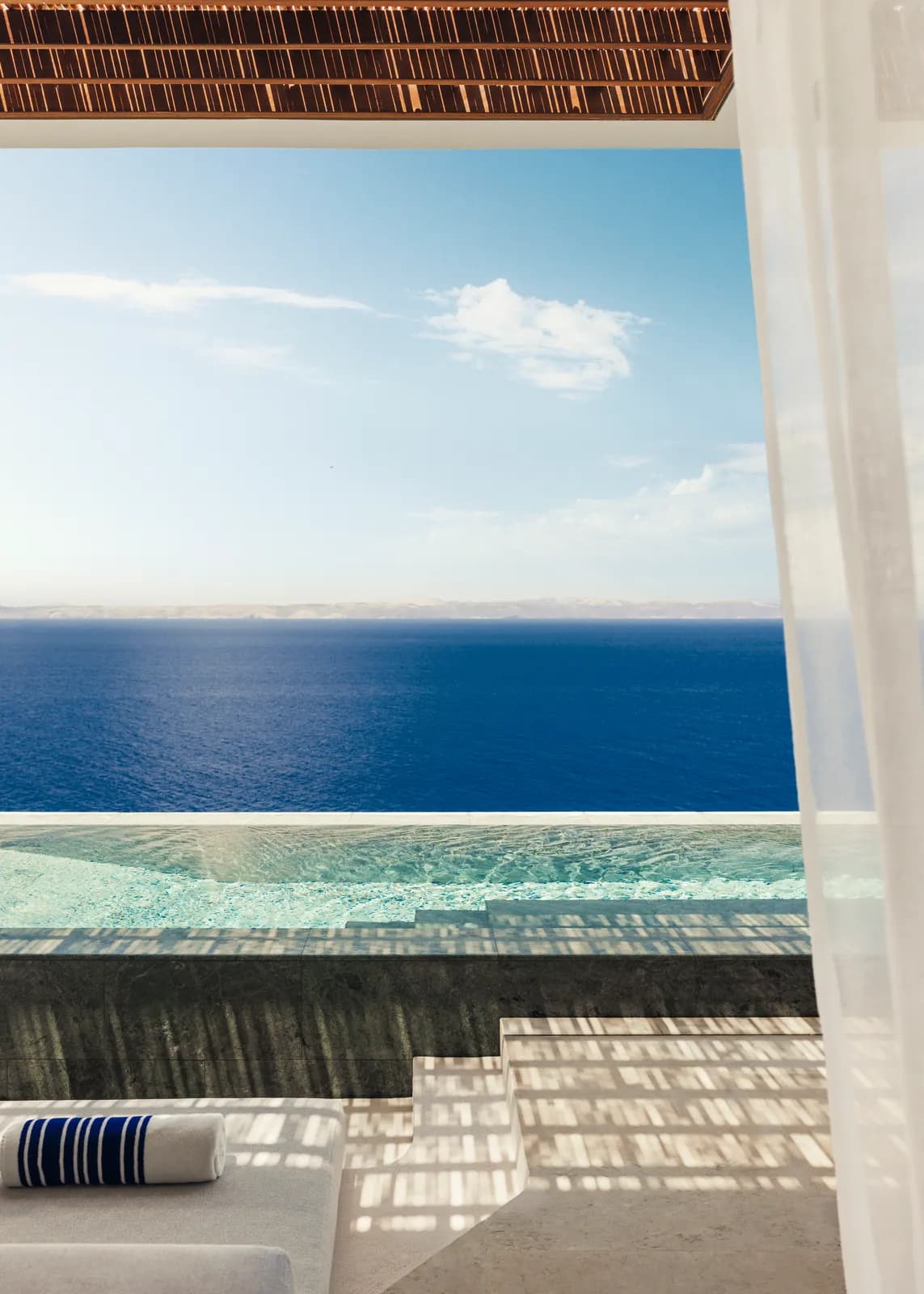 Infinity pool of the One&Only Kéa Island above Vroskopos bay