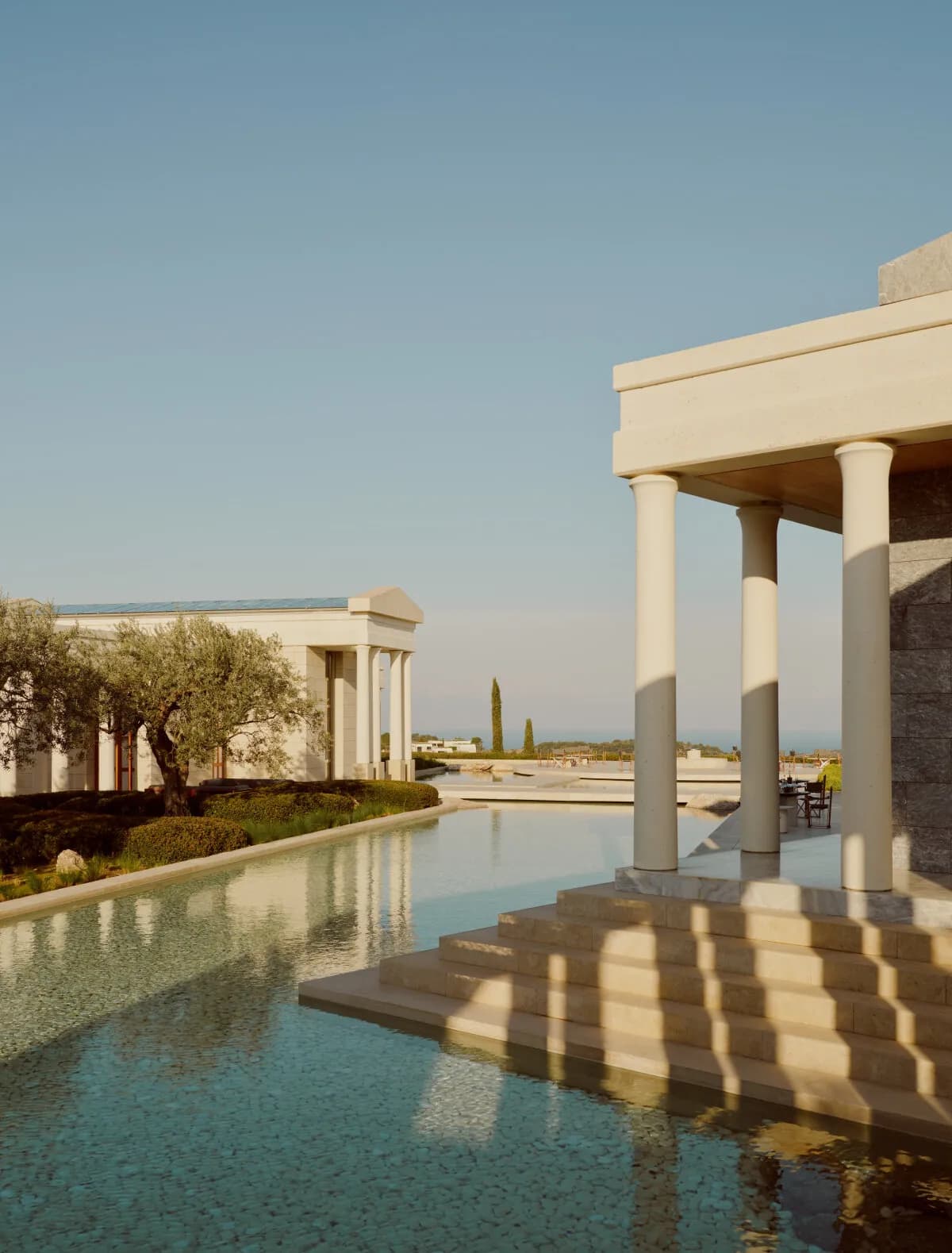 The Amanzoe pool in front of the colonnade above Porto Heli