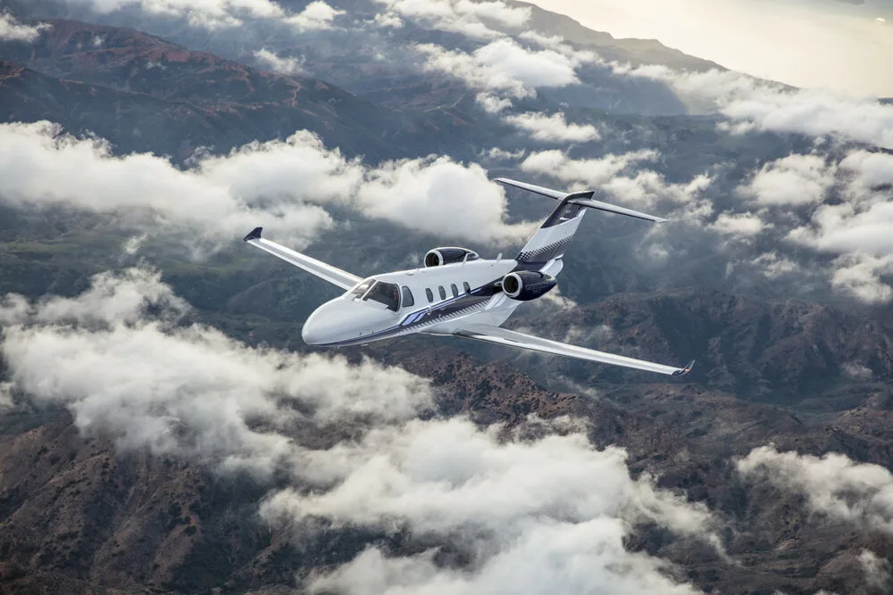 Cessna Citation M2 above the clouds